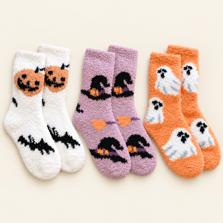 Halloween bundle: white pumpkin and bat socks, pale lilac witch-hat socks and soft orange ghost socks