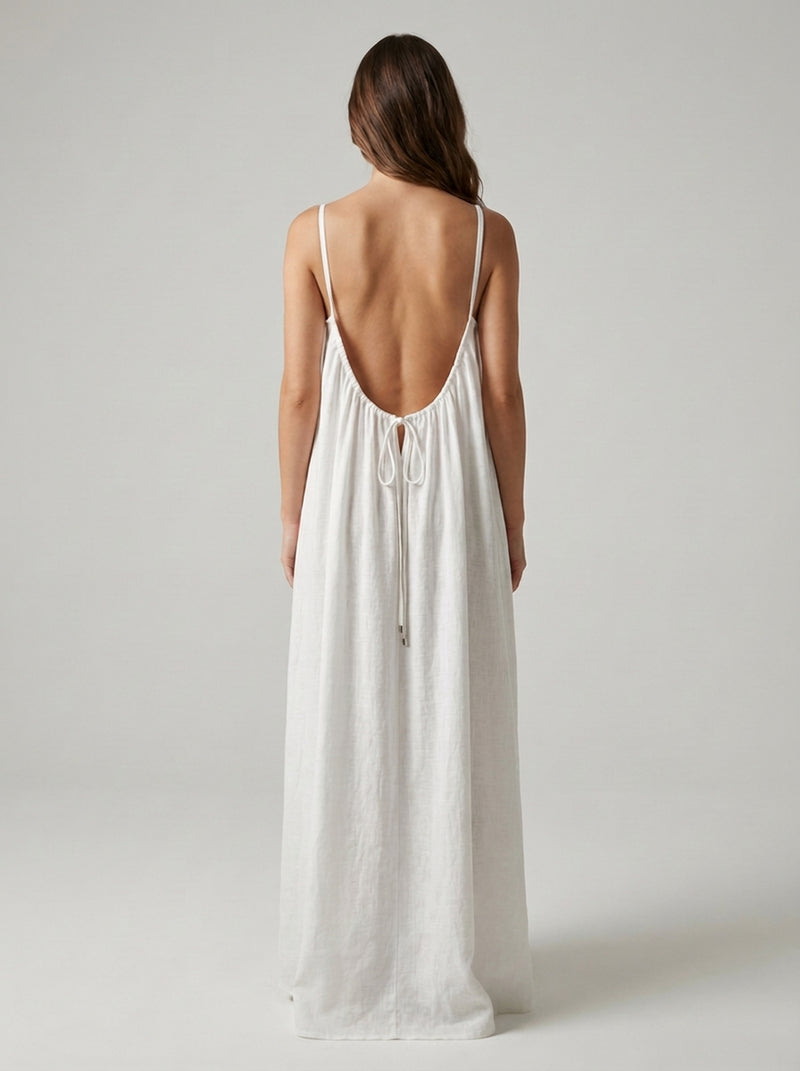 White Driftline dress showing its low open back and tie